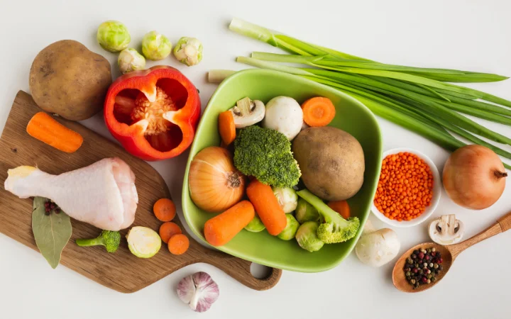 Image showcasing key ingredients of Broccoli Cheddar Soup, including fresh broccoli, cheddar cheese, onions, garlic, and carrots, arranged in an attractive and health-conscious layout. Nutritional information and benefits of each ingredient are subtly highlighted, emphasizing the soup's nutritious aspects.