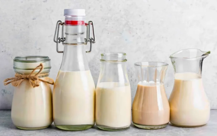 collage of containers, heavy cream, light cream, coconut cream, almond milk cream, light background