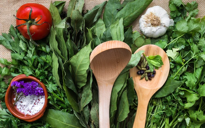 A traditional Argentine kitchen setting with ingredients and utensils for making chimichurri.