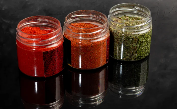  Two bowls, one with green chimichurri and the other with red chimichurri, showcasing their distinct colors and textures.