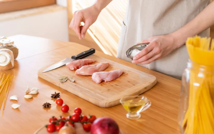 A step-by-step visual guide in a kitchen setting showing the process of making Chicken Gnocchi Soup, from browning the chicken to adding gnocchi and finishing touches, each step captured in sequence.