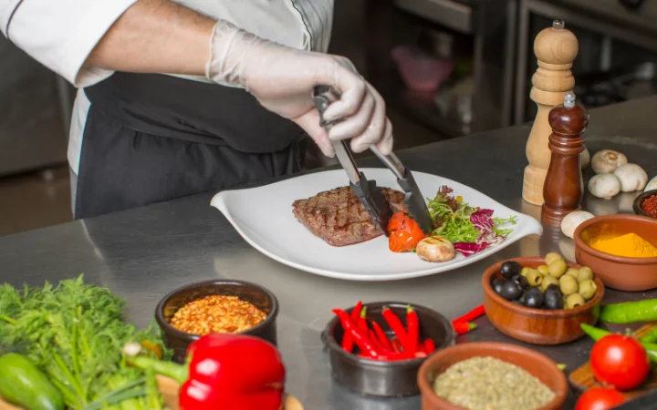 A beautifully plated serving of vegan corned beef with traditional sides like cabbage and potatoes, presented in a homely setting.