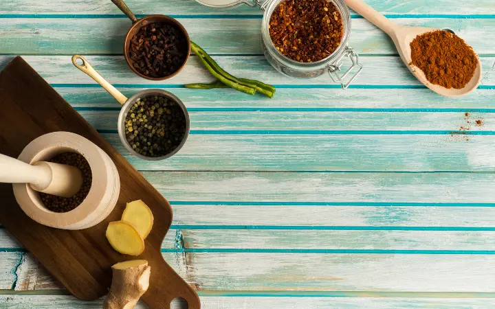 a selection of various herbs and spices, representing the search for chimichurri substitutes.