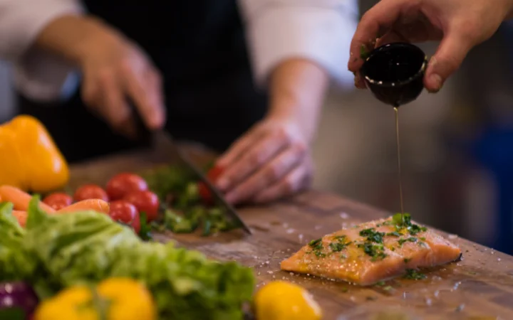 A beautifully plated dish of chimichurri salmon, showcasing the vibrant green sauce over a perfectly cooked salmon fillet.