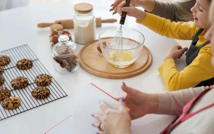 A heartwarming family scene, with generations coming together to bake Nestle chocolate chip cookies, symbolizing tradition and cultural impact.