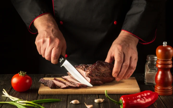 A kitchen scene focused on a chef slicing perfectly tender corned beef, with infographics showing tips like 'low and slow cooking', 'checking for doneness', and 'flavor enhancements'.