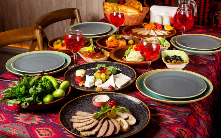 An elegant dining table set with sliced corned beef, accompanied by classic sides like cabbage and root vegetables, and condiments like mustard, showcasing an ideal presentation.