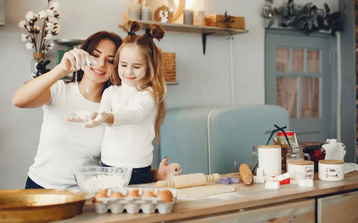 Heartwarming scene of a family baking chocolate chip cookies together in a home kitchen, symbolizing comfort, togetherness, and a joyful atmosphere.