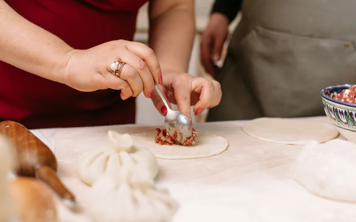 Making crab puffs, putting the filling in a pepper dough. homemade food