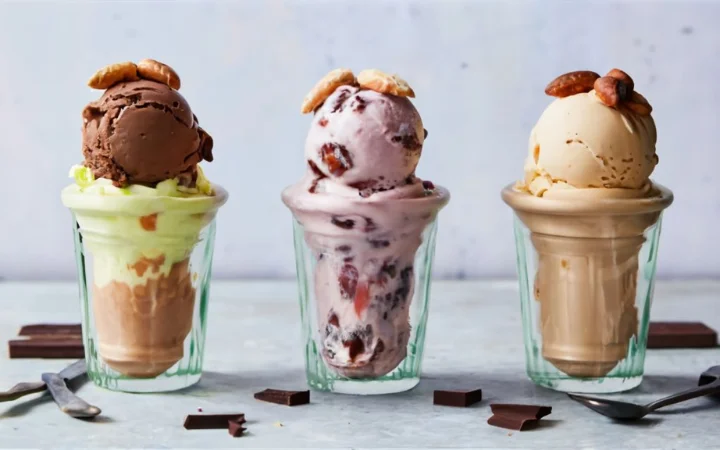 A creative display of fresh dessert variations, including no-churn, dairy-free, and vegan options, with alternative ingredients like coconut milk, almond milk, and various toppings like dark chocolate and natural sweeteners.