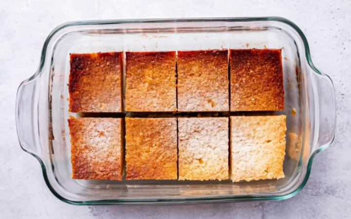 An informative image featuring the churro cheesecake in a storage container, with visual cues on proper storage techniques. The image should convey a sense of freshness and the importance of preserving the dessert's quality.