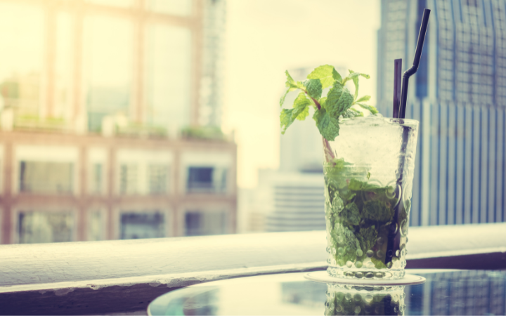 A panoramic view of a peppermint drink on window backround, showcasing it's freshness.