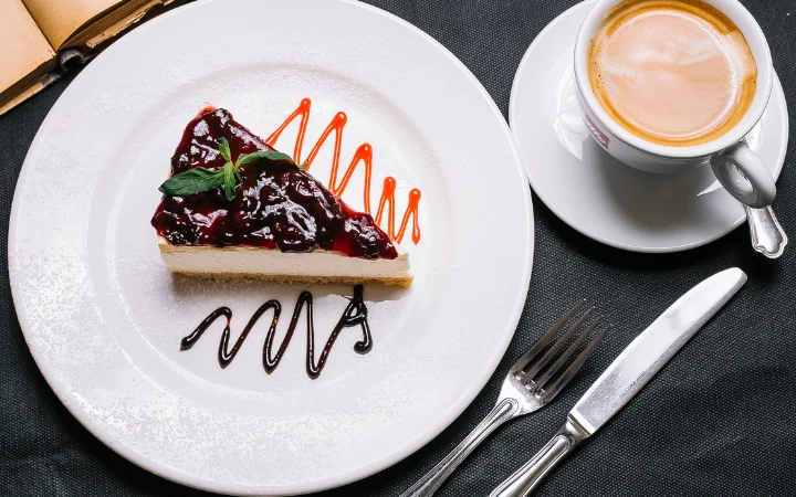 Top view strawberry dessert with a cup of cappuccino