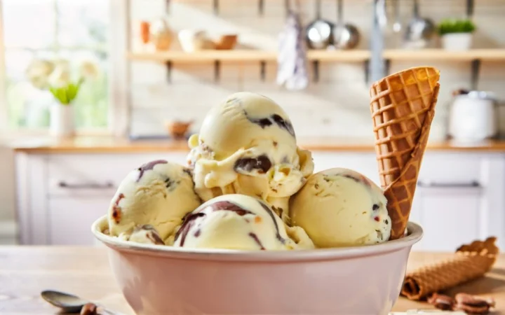 A heartwarming image of ice cream , the joy of ice cream, creativity in making it, and the pleasure of sharing, with a backdrop of a sunny, happy kitchen.