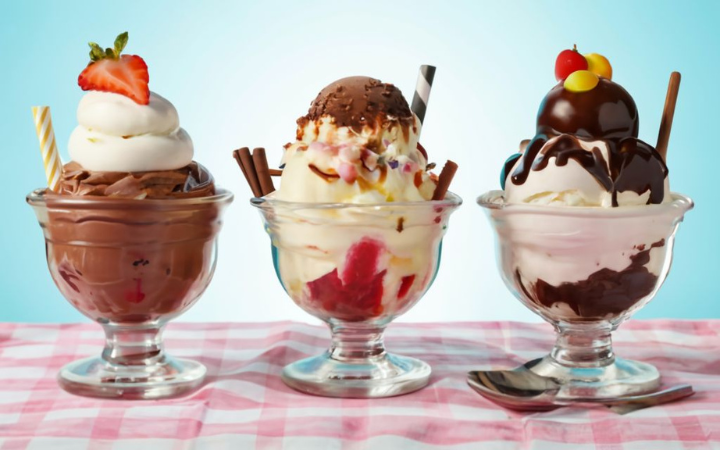 sharing sundaes around a table, with a montage of sundae varieties in the background, reflecting the timeless appeal and shared happiness sundaes bring to all ages.