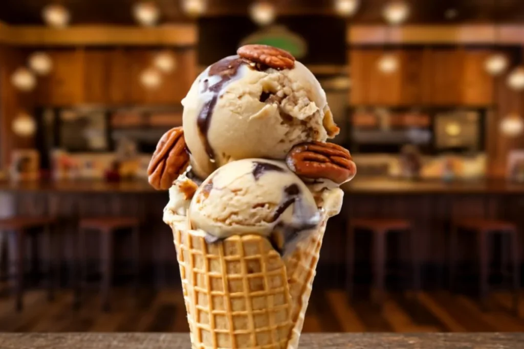 A vibrant scoop of turtle ice cream with creamy vanilla, toasted pecans, gooey caramel, and rich chocolate fudge, set against a backdrop of an ice cream parlor filled with excitement and nostalgia